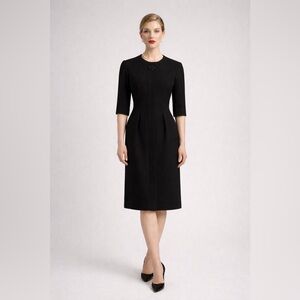 Vintage 1960s 100% wool Hanro of Switzerland black tailored dress. 12